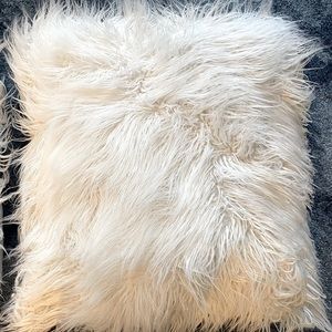 2 large matching faux-fur pillows